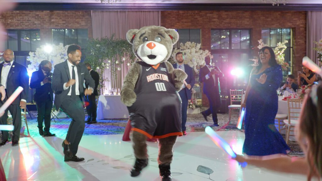Houston Rockets mascot Clutch dancing at wedding reception